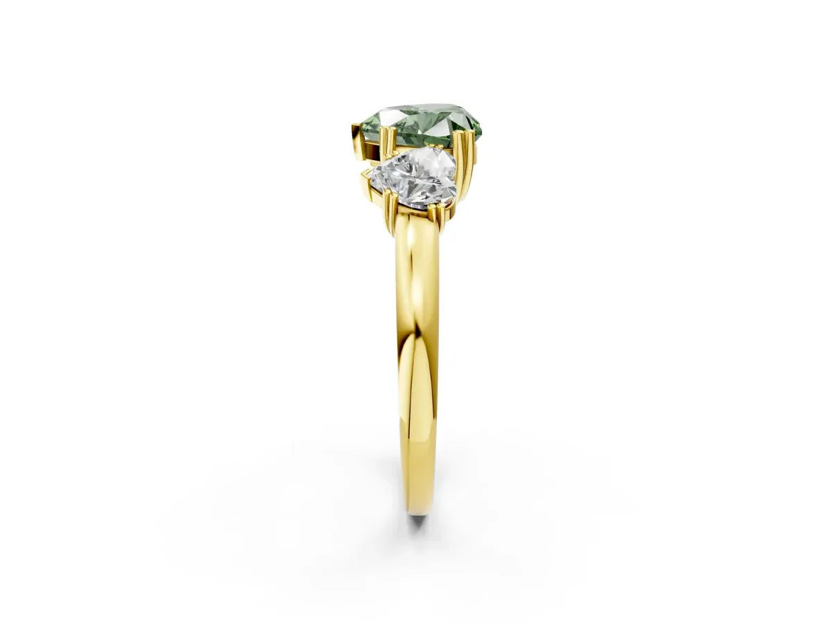 Fancy Green Three-Stone Heart Cut Cut Diamond Ring with Channel Set Band and Four-Prong Setting Yellow gold