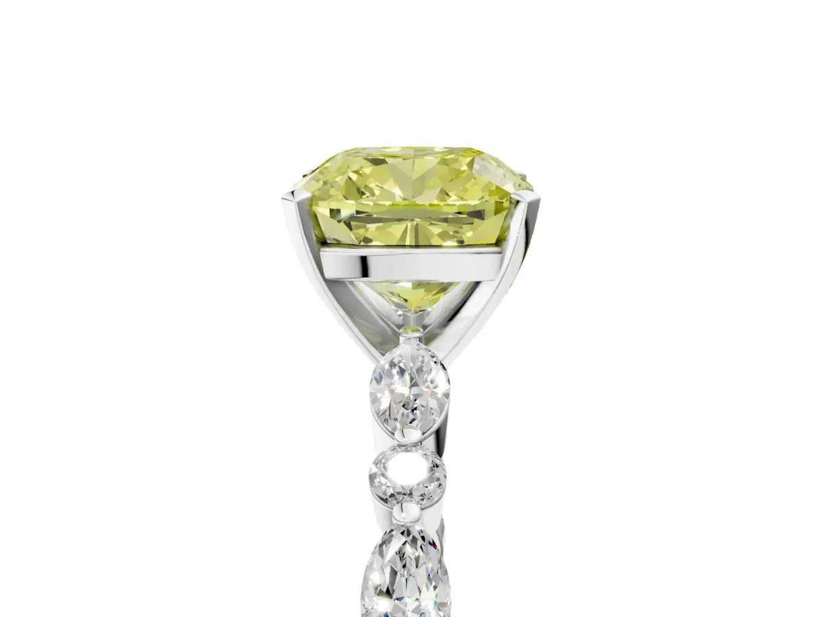 Fancy Yellow Cushion Cut Diamond Ring with Marquise and Round Side Stones and Four-Prong Setting Platinum