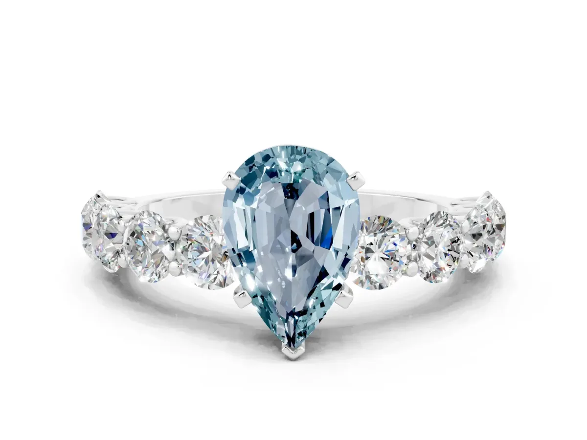 Pear Cut Aquamarine Prong Setting with Side Stones on a Pave Band Silver