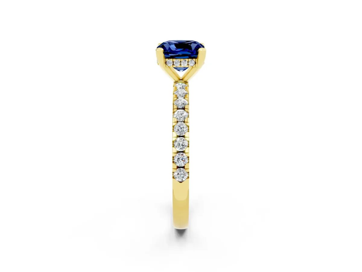Cushion Cut Blue Sapphire Solitaire Ring with Round Pavé Band and Four-Prong Setting Yellow gold