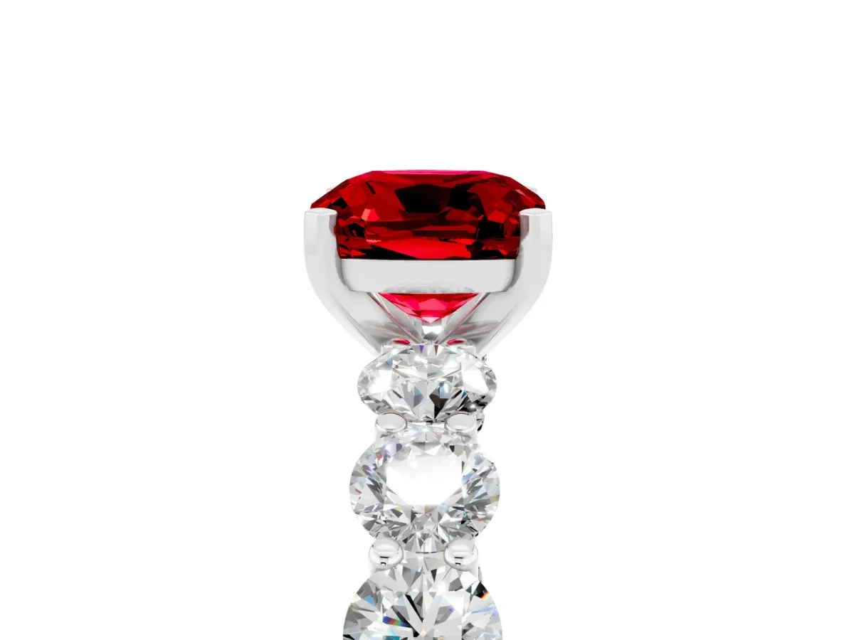 Cushion Cut Ruby Prong Setting with Side Stones on a Pave Band White gold