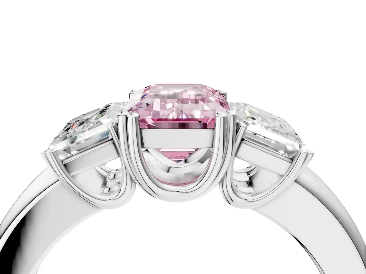 Fancy Pink Three-Stone Emerald Cut Cut Diamond Ring with Channel Set Band and Four-Prong Setting Platinum