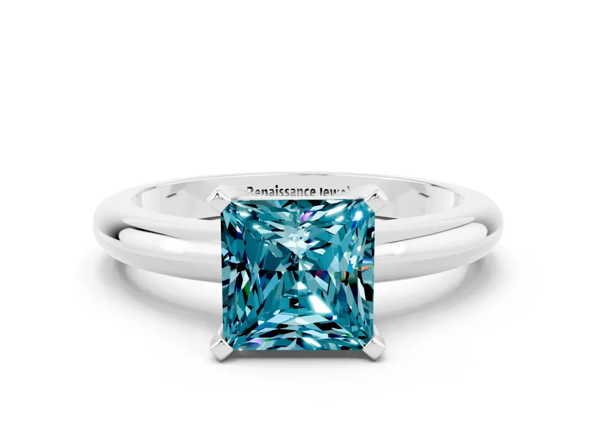 Princess Cut Blue Topaz Solitaire Engagement Ring with Round Band and Four-Prong Setting White gold