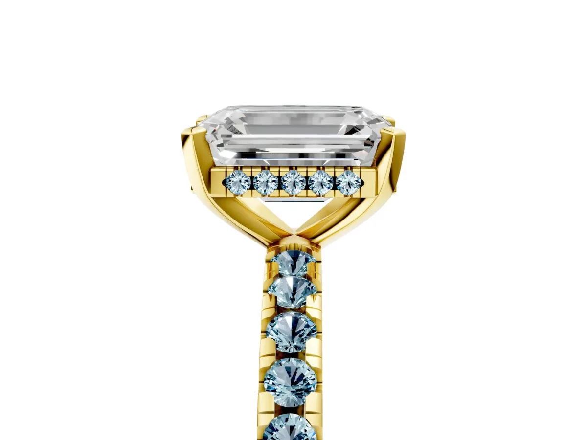 Emerald Cut Diamond Solitaire Ring with Round Aquamarine Pavé Band and Four-Prong Setting Yellow gold