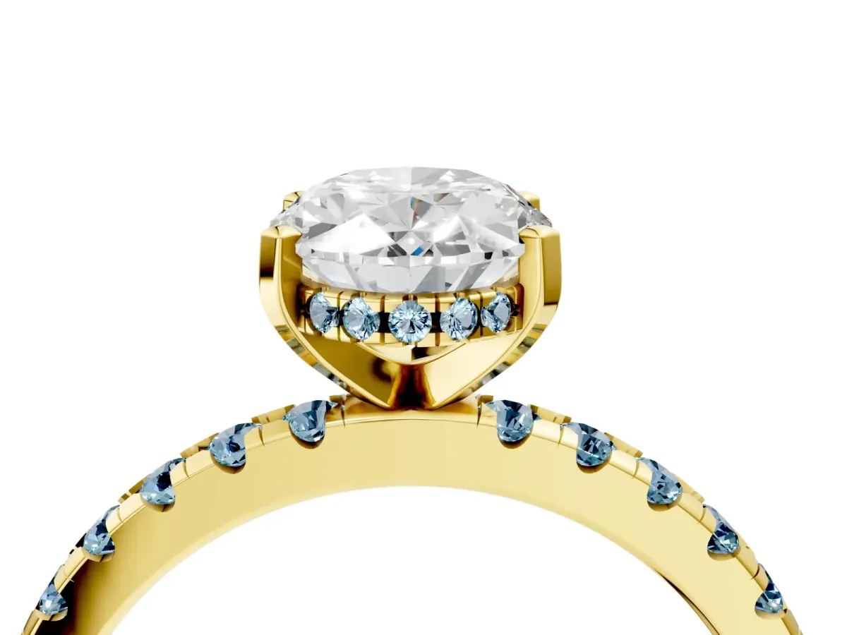 Oval Cut Diamond Solitaire Ring with Round Aquamarine Pavé Band and Four-Prong Setting Yellow gold