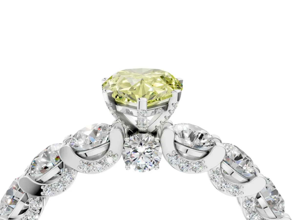 Fancy Yellow Pear Cut Diamond Side Stone Engagement Ring with Four-Prong Setting White gold