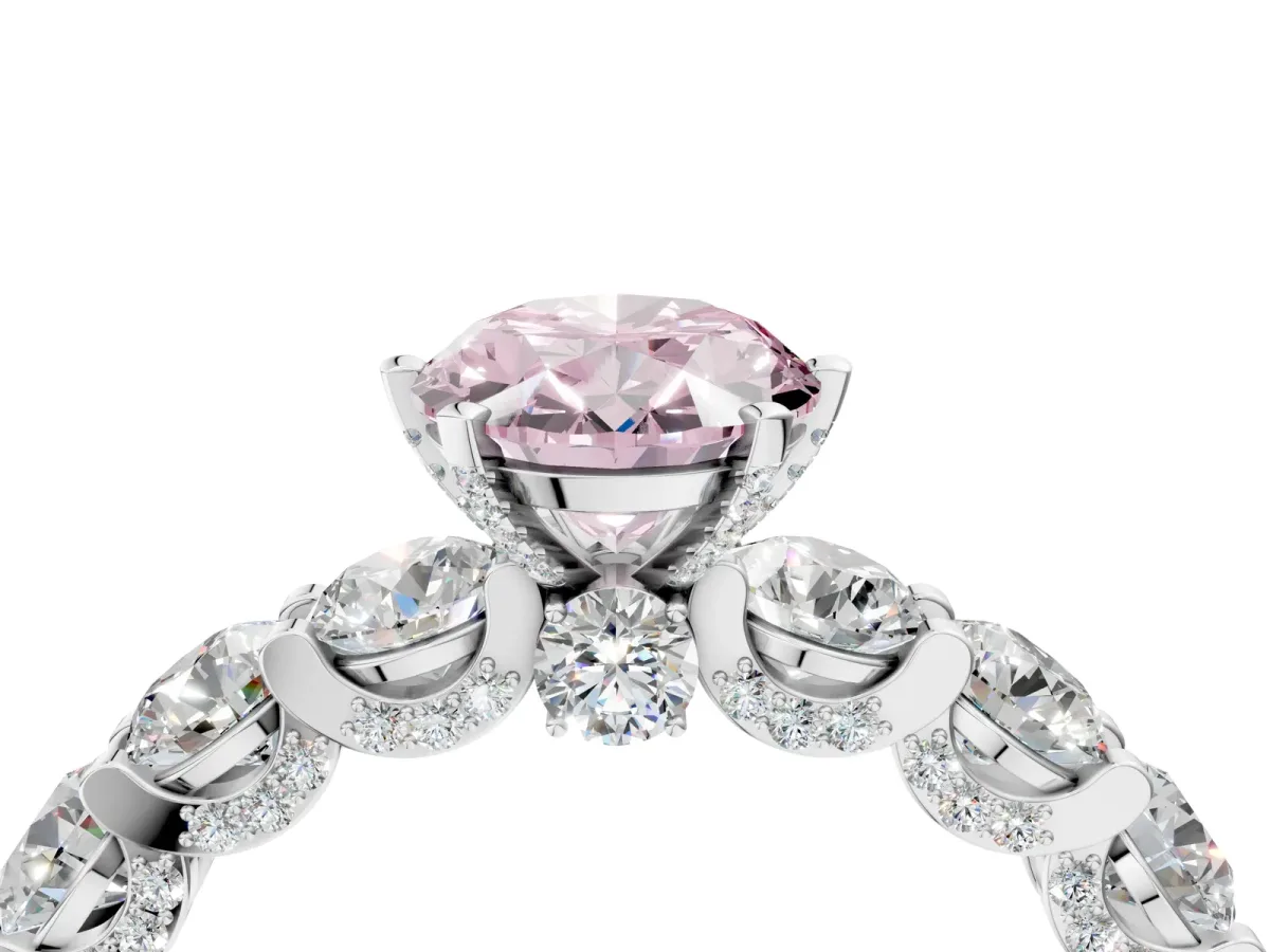 Fancy Pink Oval Cut Diamond Side Stone Engagement Ring with Four-Prong Setting Platinum