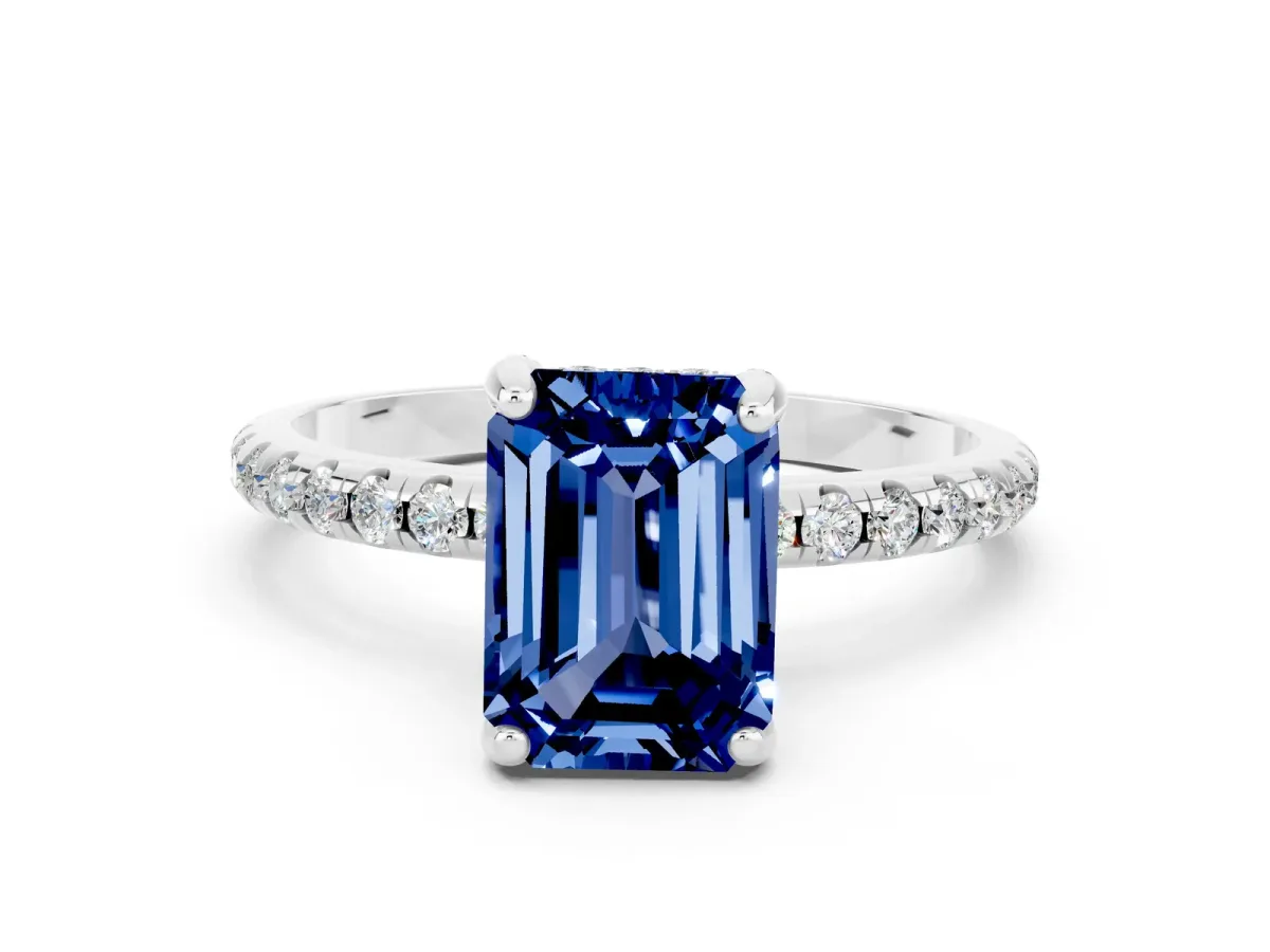 Emerald Cut Blue Sapphire Hidden Halo Engagement Ring with Round Pavé Band and Prong Setting Silver