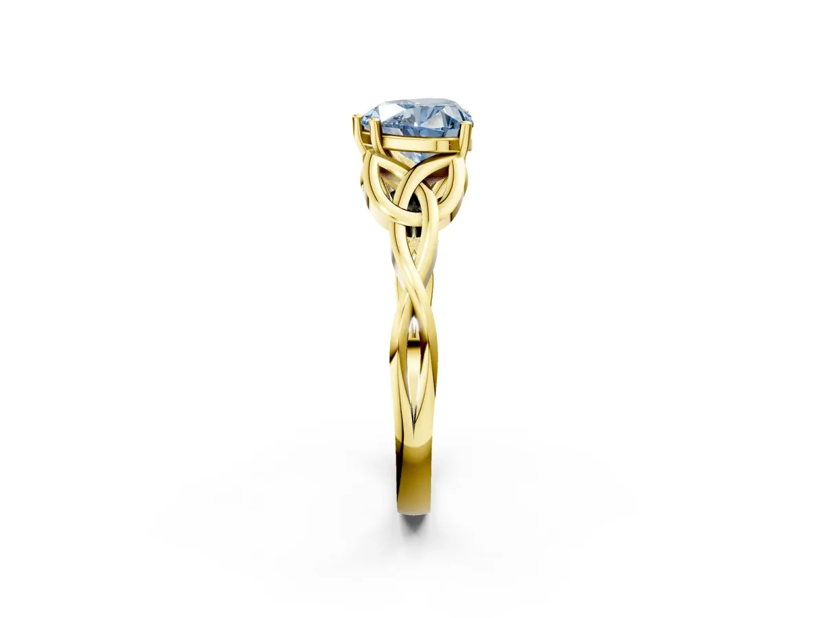 Fancy Blue Heart Cut Diamond Solitaire Engagement Ring with Celtic Knot Band and Four-Prong Setting Yellow gold