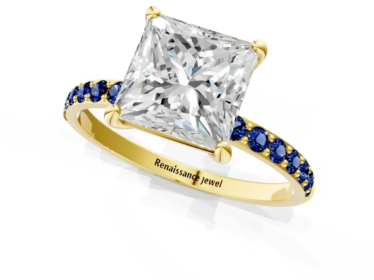 Princess Cut Diamond Solitaire Ring with Round Blue Sapphire Pavé Band and Prong Setting Yellow gold