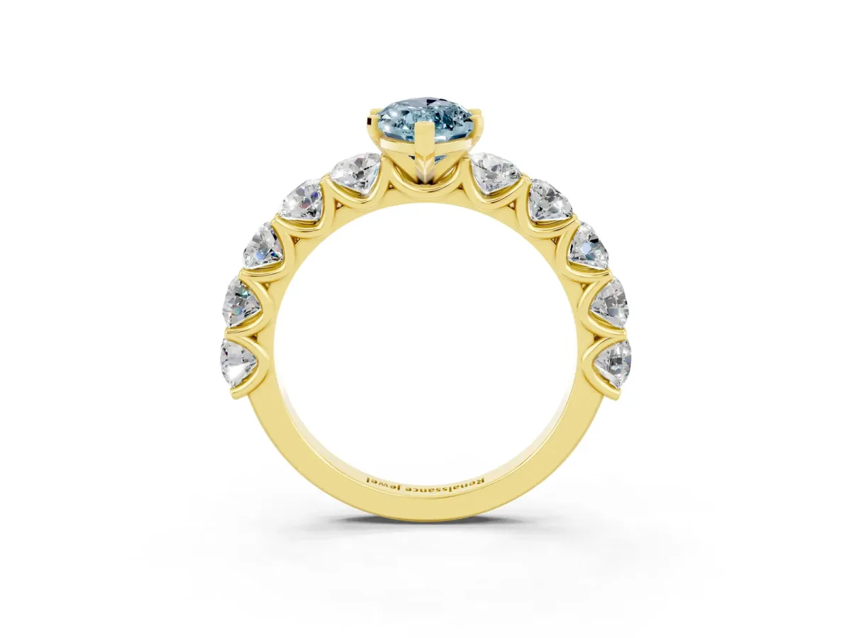 Marquise Cut Aquamarine Prong Setting with Side Stones on a Pave Band Yellow gold