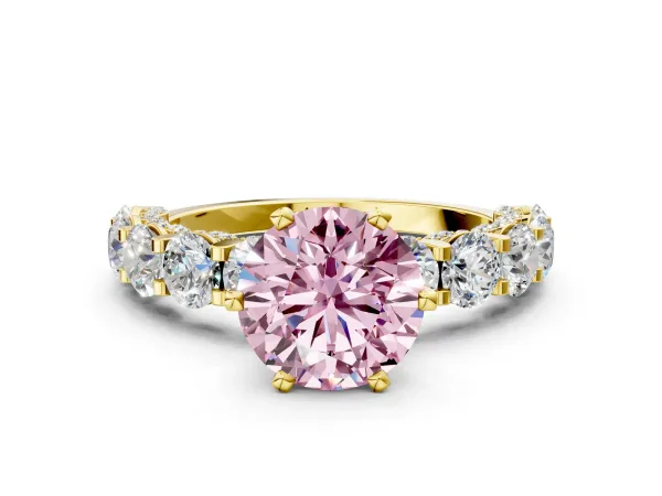 Fancy Pink Round Cut Diamond Side Stone Engagement Ring with Four-Prong Setting Yellow gold