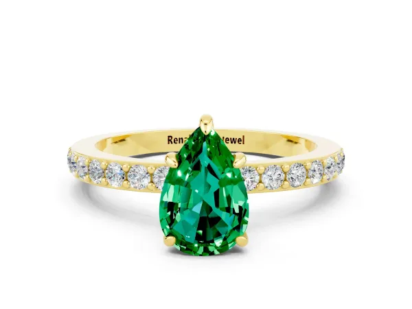 Pear Cut Emerald Solitaire Engagement Ring with Pavé Band and Four-Prong Setting Yellow gold