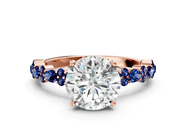 Round Cut Diamond Side Stone Solitaire Ring with Round Blue Sapphire and Four-Prong Setting Rose gold