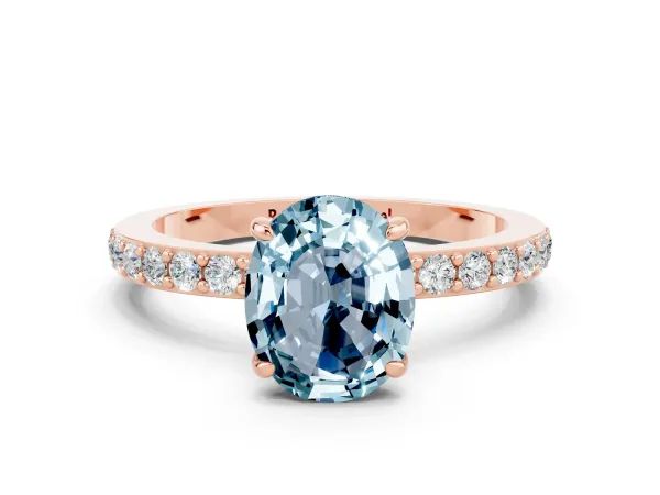 Oval Cut Aquamarine Solitaire Engagement Ring with Pavé Band and Four-Prong Setting Rose gold